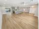 Open living area with light flooring and kitchen views at 1900 63Rd S Ave, St Petersburg, FL 33712