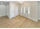 Bright entryway with white doors and wood-look flooring at 1900 63Rd S Ave, St Petersburg, FL 33712