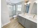 Modern bathroom with double vanity and walk-in shower at 1900 63Rd S Ave, St Petersburg, FL 33712