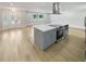 Open living area with kitchen island and entryway at 1900 63Rd S Ave, St Petersburg, FL 33712