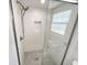 Updated shower with hexagon tile and brass fixtures at 1900 63Rd S Ave, St Petersburg, FL 33712