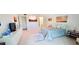Primary bedroom with large bed and ensuite bathroom at 531 Spring Lakes Blvd # 531, Bradenton, FL 34210