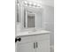 Updated bathroom with white vanity and a large mirror at 811 N Keene Rd # V7, Clearwater, FL 33755