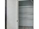 White storage room with three shelves at 811 N Keene Rd # V7, Clearwater, FL 33755