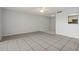Dining area with tiled floors and kitchen access at 811 N Keene Rd # V7, Clearwater, FL 33755