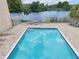 Inviting community pool with lake view; steps away from relaxing patio furniture at 811 N Keene Rd # V7, Clearwater, FL 33755