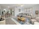 Living room with staged furniture and dining area at 811 N Keene Rd # V7, Clearwater, FL 33755