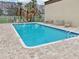 Refreshing community pool with plenty of lounge chairs for sunbathing at 811 N Keene Rd # V7, Clearwater, FL 33755