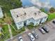 Aerial view of condo building near lake with parking at 811 N Keene Rd # V7, Clearwater, FL 33755