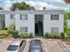 Exterior view of condo building with parking and landscaping at 811 N Keene Rd # V7, Clearwater, FL 33755