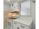 Clean kitchen with white cabinets and an electric stove at 811 N Keene Rd # V7, Clearwater, FL 33755