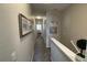 Upstairs hallway with neutral walls and carpeted flooring at 7224 Ketch Pl, Bradenton, FL 34212