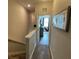 Upstairs hallway with carpet, leading to a bedroom and the stairs at 7224 Ketch Pl, Bradenton, FL 34212