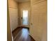 Bright entryway with wood-look floors, and double door closet at 7224 Ketch Pl, Bradenton, FL 34212
