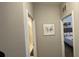 Hallway with neutral walls and artwork at 7224 Ketch Pl, Bradenton, FL 34212