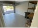Attached garage with ample storage shelving and epoxy flooring at 7224 Ketch Pl, Bradenton, FL 34212