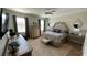 Spacious bedroom with large bed, dresser, and window coverings at 7224 Ketch Pl, Bradenton, FL 34212