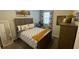 Cozy bedroom with a queen-size bed and dresser at 7224 Ketch Pl, Bradenton, FL 34212