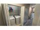 Convenient laundry closet with washer, dryer and storage shelves at 7224 Ketch Pl, Bradenton, FL 34212