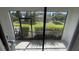 Private screened patio overlooking a lush green landscape at 7224 Ketch Pl, Bradenton, FL 34212