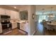 Modern kitchen with stainless steel appliances and white cabinets at 7224 Ketch Pl, Bradenton, FL 34212