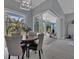 Bright dining room with sliding glass doors leading to the pool area at 11 Tee View Rd, Rotonda West, FL 33947
