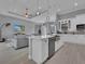 Open concept kitchen with large island and stainless steel appliances at 11 Tee View Rd, Rotonda West, FL 33947