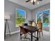 Home office with a view of the pool and sliding glass doors at 11 Tee View Rd, Rotonda West, FL 33947