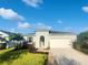 One-story house with a two-car garage and landscaped lawn at 11516 Palmetto Sands Ct, Tampa, FL 33626