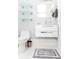 Bright bathroom featuring modern vanity, floating shelves, and gray tile flooring accents at 236 20Th Ave Se, St Petersburg, FL 33705