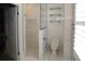 Modern bathroom showcasing walk-in shower, toilet, glass shelves and mosaic tile at 236 20Th Ave Se, St Petersburg, FL 33705