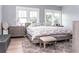 Bright bedroom featuring three windows, neutral decor, and a comfortable king-size bed at 236 20Th Ave Se, St Petersburg, FL 33705