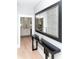 Elegant entryway with a decorative mirror, console table, and view into the kitchen at 236 20Th Ave Se, St Petersburg, FL 33705