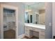 Bright dressing area featuring custom vanity, mirror, and closet at 236 20Th Ave Se, St Petersburg, FL 33705