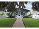Charming bungalow with a gray exterior, white trim, and a landscaped front yard at 236 20Th Ave Se, St Petersburg, FL 33705