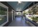 Inviting front porch with patterned tile flooring, ceiling fans, and ample seating at 236 20Th Ave Se, St Petersburg, FL 33705
