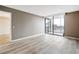Living room with sliding glass doors that open onto a private balcony at 6219 Palma Del Mar S Blvd # 301, St Petersburg, FL 33715
