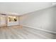 Living room with wood-style flooring, chandelier, and neutral walls at 6219 Palma Del Mar S Blvd # 301, St Petersburg, FL 33715