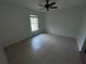 Spacious bedroom with tile flooring and ceiling fan at 4495 Amari Rd, North Port, FL 34291