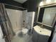 Updated bathroom with gray vanity and shower/tub at 4495 Amari Rd, North Port, FL 34291