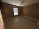 Bright bedroom featuring tile floors and a ceiling fan at 4495 Amari Rd, North Port, FL 34291