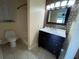 Bathroom with dark vanity and mosaic tile accents at 4495 Amari Rd, North Port, FL 34291