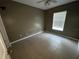 Simple bedroom with tile floors and a window with blinds at 4495 Amari Rd, North Port, FL 34291