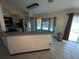 Kitchen with breakfast bar and view of backyard at 4495 Amari Rd, North Port, FL 34291
