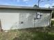 Exterior wall with electrical meter and other utilities at 4495 Amari Rd, North Port, FL 34291