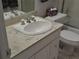 Clean bathroom with a white sink and toilet at 731 Fox Hills Dr, Sun City Center, FL 33573