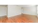 Large bedroom with wood floors and access to hallway at 12103 Deertrack Loop, Spring Hill, FL 34610