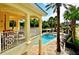 Beautiful view of the pool from the home's balcony with ample lounging space at 6450 Watercrest Way # 402, Lakewood Ranch, FL 34202