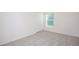 Comfortable bedroom with carpet flooring and closet at 18059 Regan Ave, Port Charlotte, FL 33948