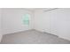Cozy bedroom with carpet flooring, closet and a bright window at 18059 Regan Ave, Port Charlotte, FL 33948